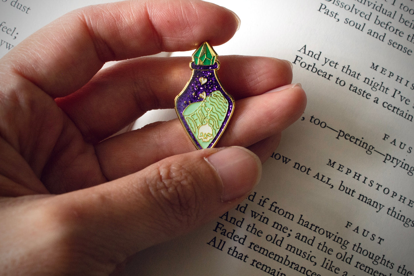 The Devil's Potion bottle held by hand
