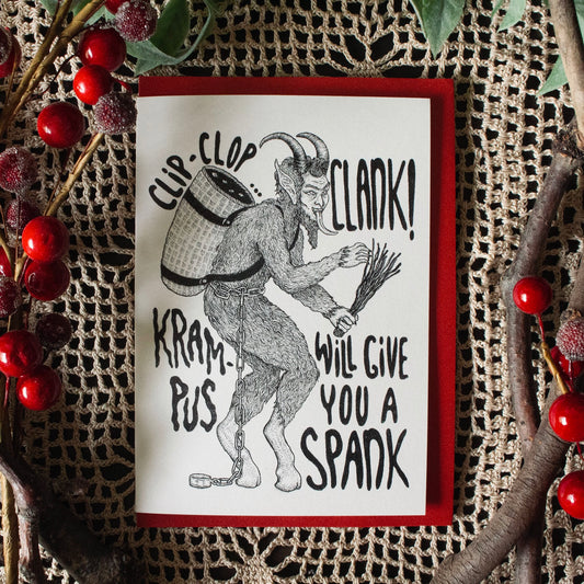 Greeting card with an image of Krampus, tip-toeing carrying a branches and a woven basket on his back